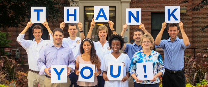 Students and Faculty Holding Thank You Sign