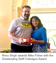 Renu Singh awards Mike Fisher with the Outstanding Staff Colleague Award.