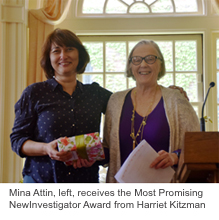  Mina Attin, left, receives the Most Promising New Investigator Award from Harriet Kitzman