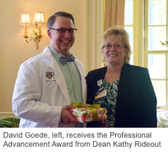 David Goede, left, receives the Professional Advancement Award from Dean Kathy Rideout