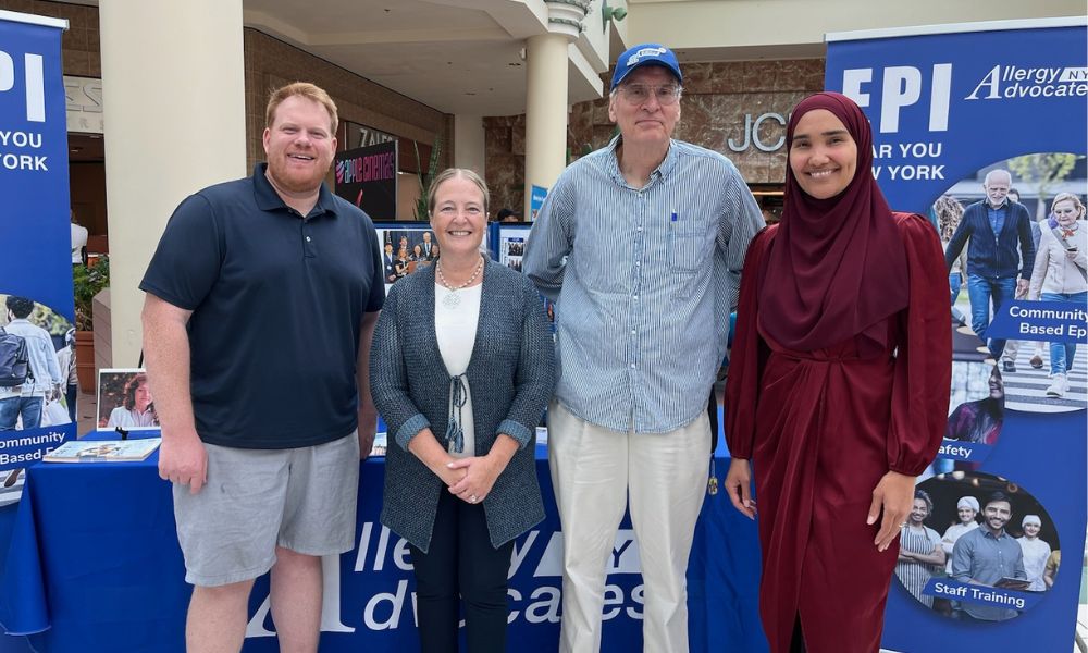 Branson speaks at a mall with fellow Allergy Advocates volunteers. 