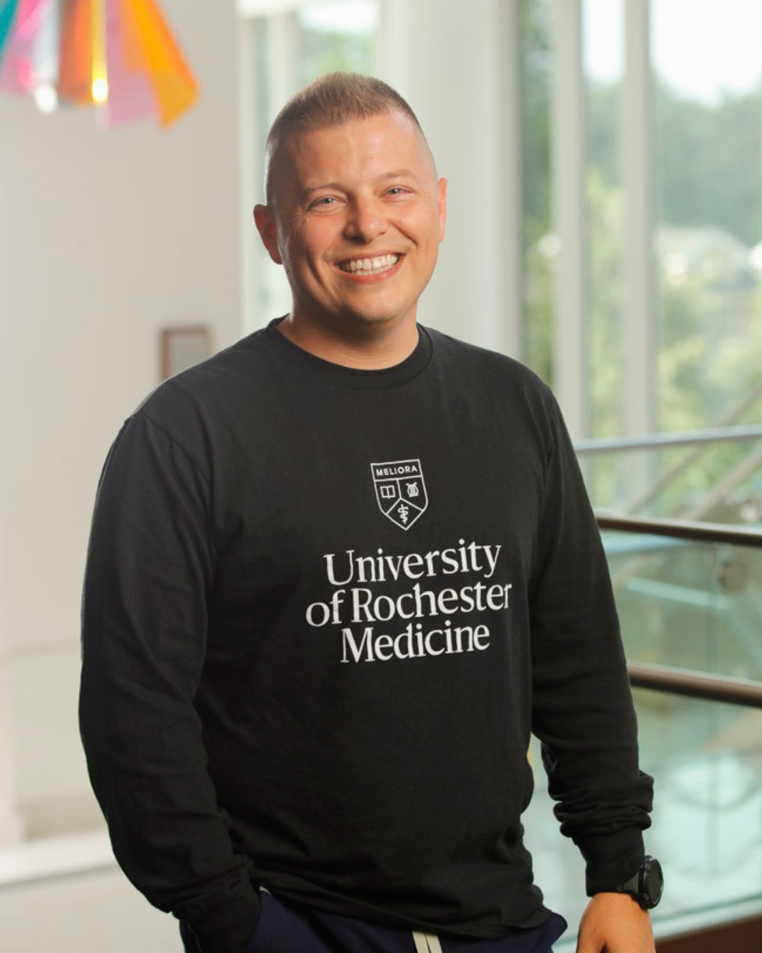 Headshot of Stephen Foster wearing a black UR Medicine tee.