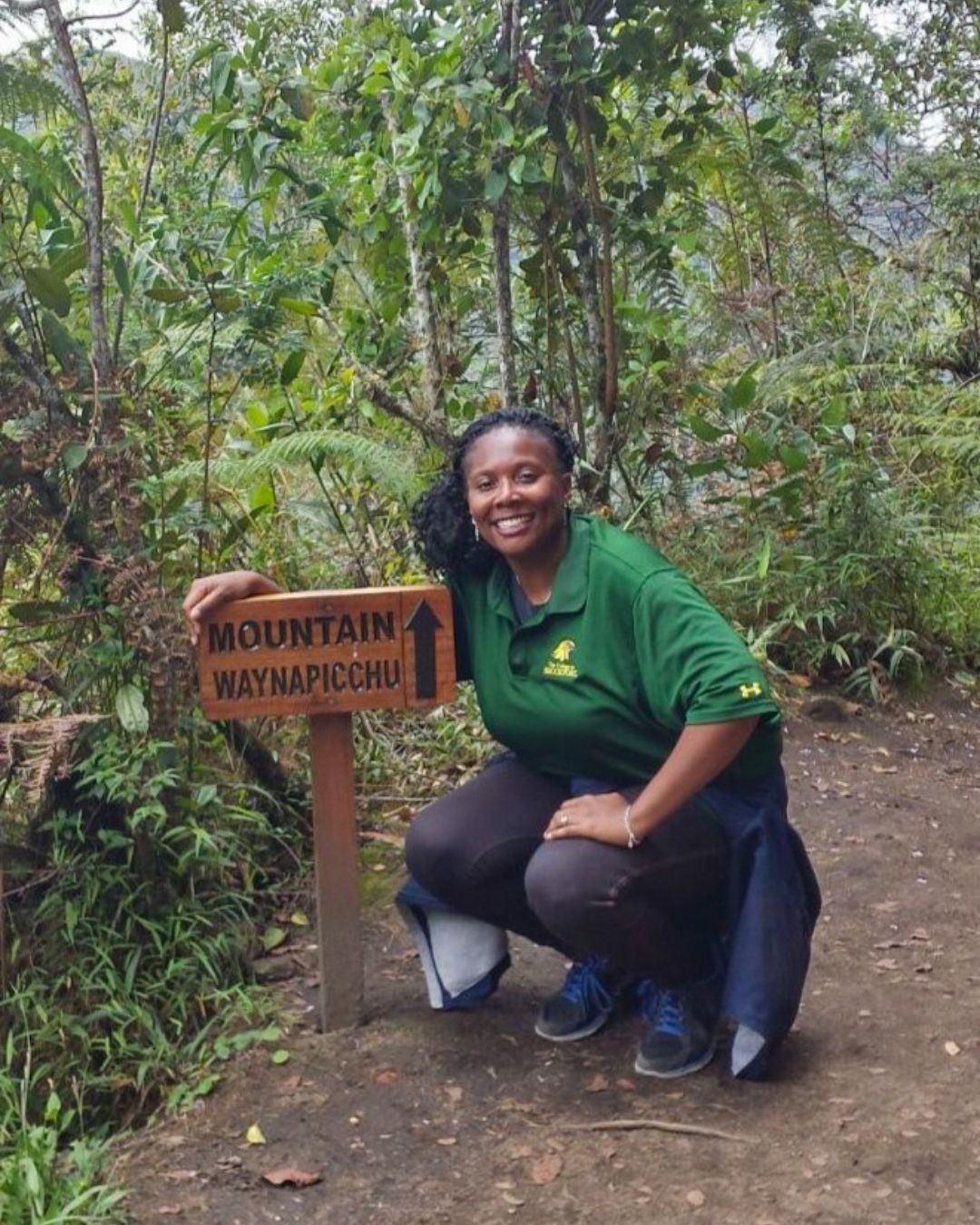Photo of Tamala on a hike, surrounded by tropical trees